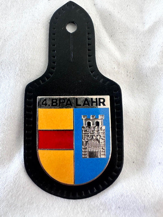 4. BPA Lahr Bereitschaftspolizeiabteilung Baden-Württemberg riot police battalion black leather pocket badge, split shield with white 4.BPA LAHR header, left field quartered gold and red Baden arms horizontal bands, right blue field with large silver raised fortified castle gatehouse Lahr city arms